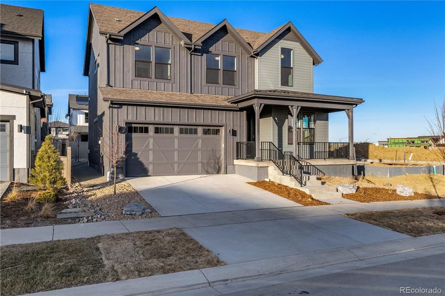 Front exterior of a new home in West Grange, Longmont, CO, highlighting curb appeal (Image 27).