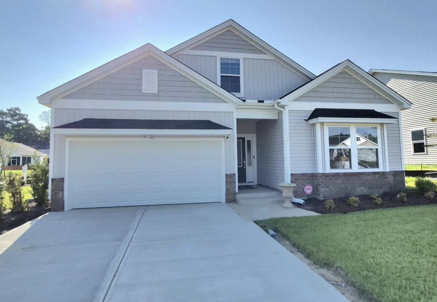 Front exterior of a new home in Jordan Grove, Conway, SC, highlighting curb appeal (Image 1). Front exterior of a new home in Jordan Grove, Conway, SC, highlighting curb appeal (Image 1).