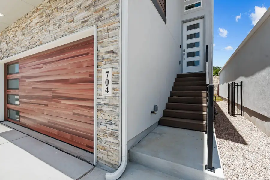 Exterior details and patio area of a home in Centero at Stone Oak, San Antonio (Image 3).