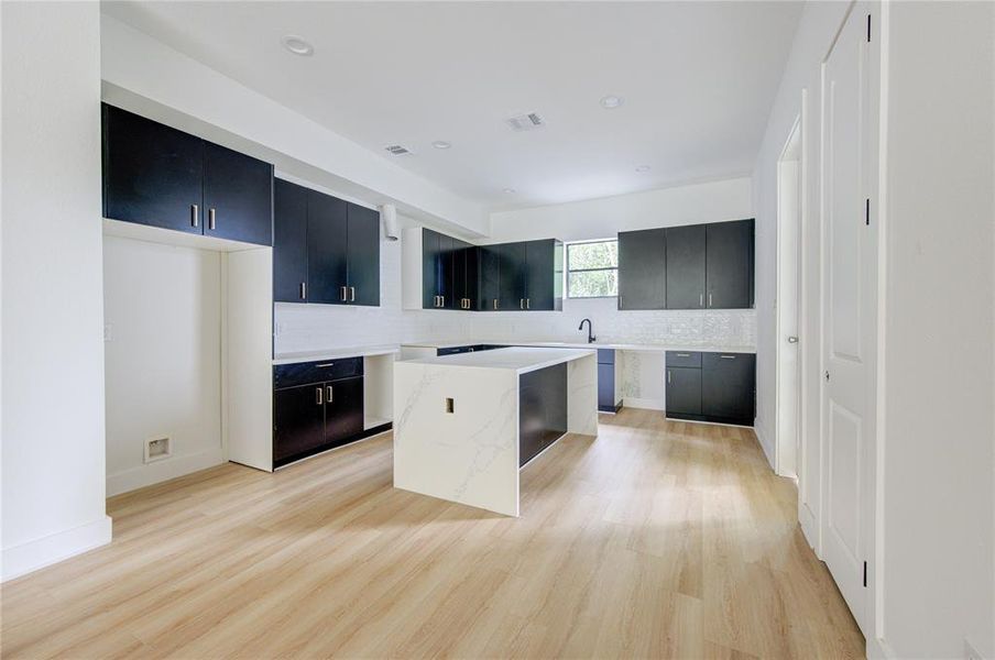 Another view of the black cabinets in the kitchen