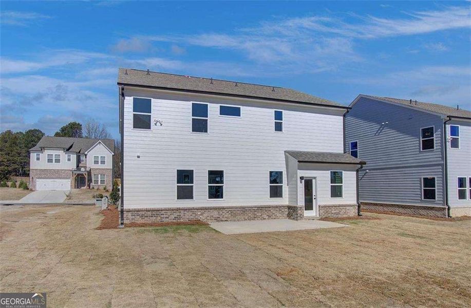 Exterior details and patio area of a home in The Paddocks at Doc Hughes, Buford (Image 26).