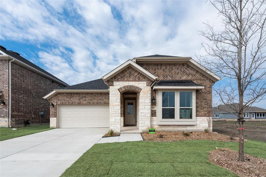 Front exterior of a new home in Walden Pond, Forney, TX, highlighting curb appeal (Image 17). Front exterior of a new home in Walden Pond, Forney, TX, highlighting curb appeal (Image 17).