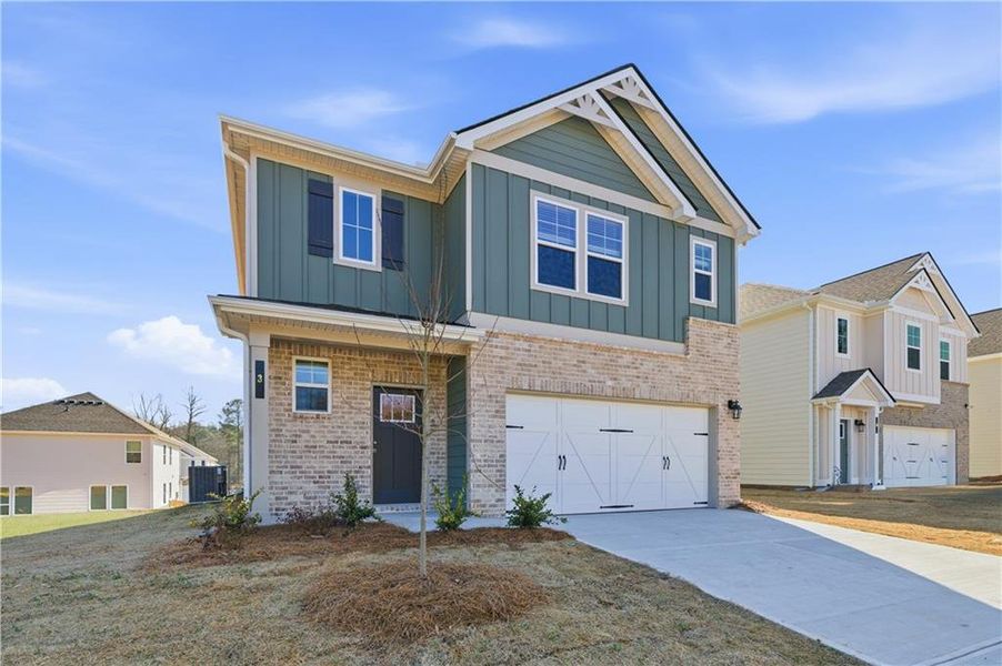 Front exterior of a new home in Enclave at Evergreen, Fairburn, GA, highlighting curb appeal (Image 21).