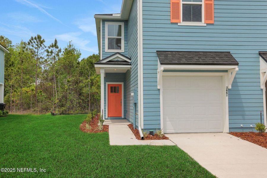 Front exterior of a new home in , Middleburg, FL, highlighting curb appeal (Image 15). Front exterior of a new home in , Middleburg, FL, highlighting curb appeal (Image 15).