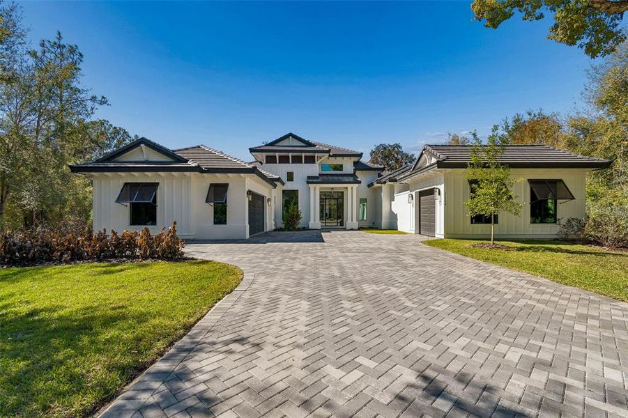 Front exterior of a new home in , Lutz, FL, highlighting curb appeal (Image 28).