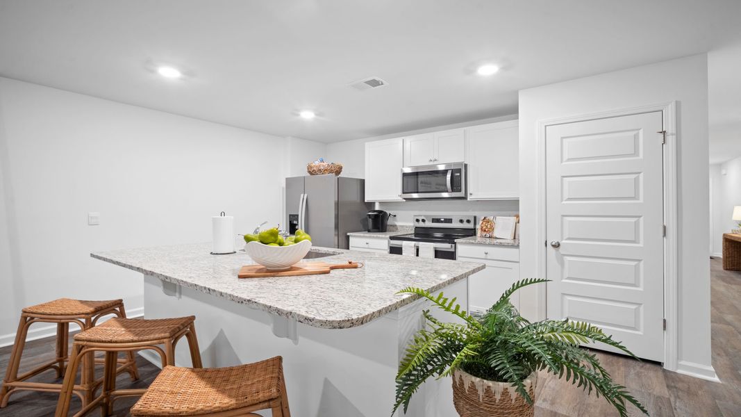 Representative furnished interior of a home built from the Freeport by D.R. Horton in Palm Ridge, Guyton (Image 4).