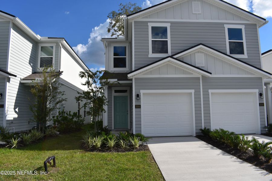 Front exterior of a new home in Irongate Villas, Jacksonville, FL, highlighting curb appeal (Image 2).