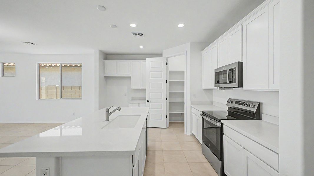 Representative furnished interior of a home built from the Acacia II by DRB Homes in Apache Farms, Buckeye (Image 12).