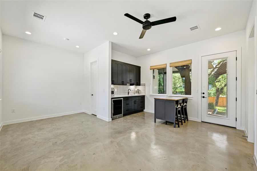 Casita with polished concrete floors, wet bar, and private exterior door — ideal for rental, office, or in-law suite. Casita with polished concrete floors, wet bar, and private exterior door — ideal for rental, office, or in-law suite.