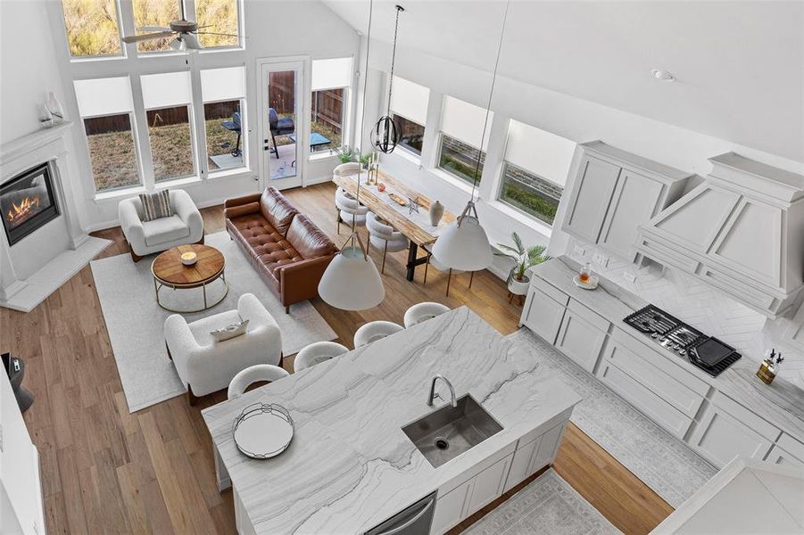 Living room featuring ceiling fan and light wood-style flooring