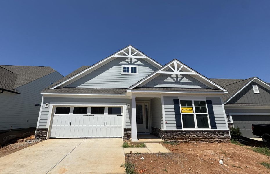 Front exterior of a new home in The Meadows at Laurelbrook, Sherrills Ford, NC, highlighting curb appeal (Image 1). Front exterior of a new home in The Meadows at Laurelbrook, Sherrills Ford, NC, highlighting curb appeal (Image 1).