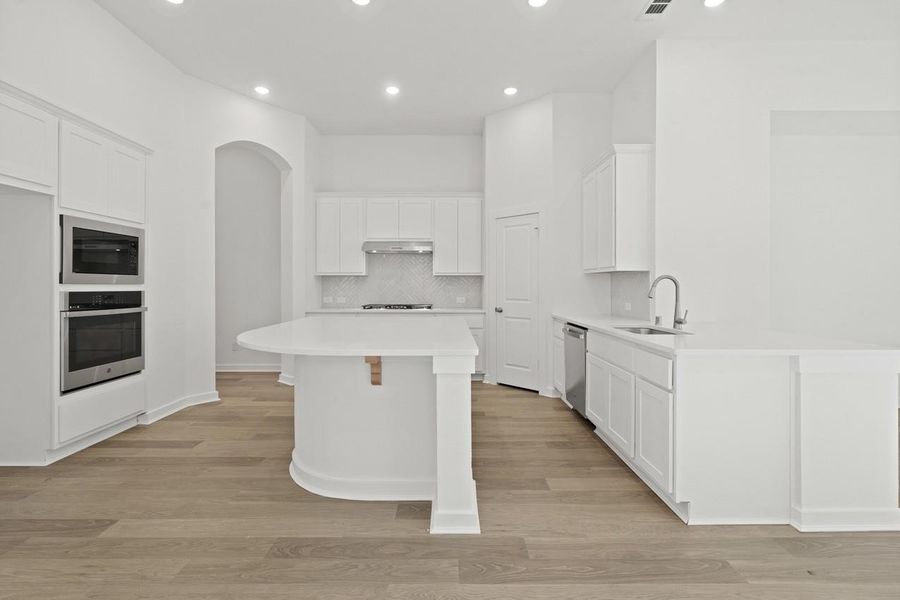 Furnished interior view inside a new home in Sunterra, Katy (Image 15).