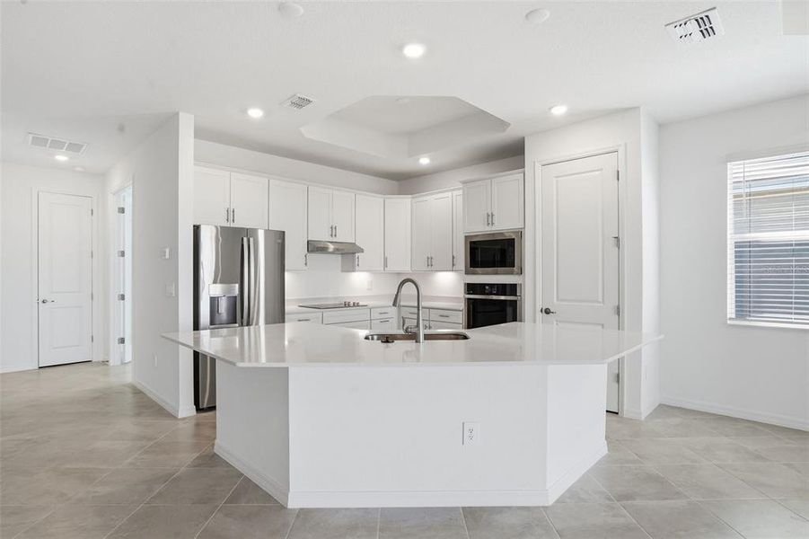 Furnished interior view inside a new home in Wellen Park Golf & Country Club, Venice (Image 12).