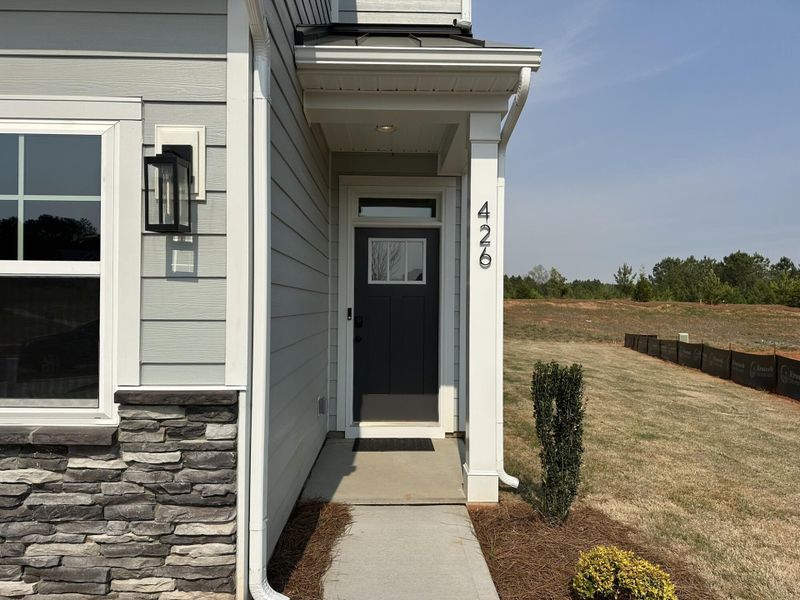 Exterior details and patio area of a home in Blythe Mill Townhomes, Waxhaw (Image 2).