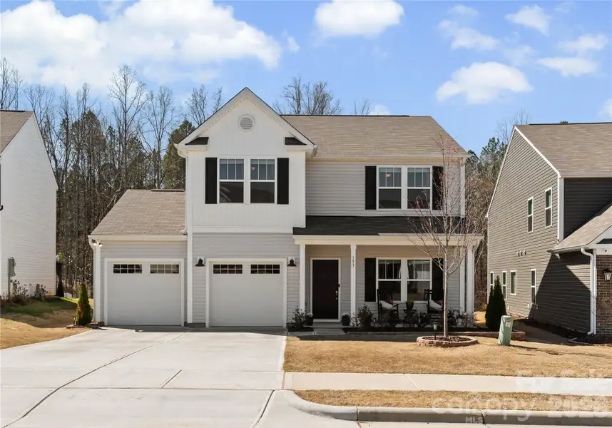 Front exterior of a new home in , Statesville, NC, highlighting curb appeal (Image 1). Front exterior of a new home in , Statesville, NC, highlighting curb appeal (Image 1).