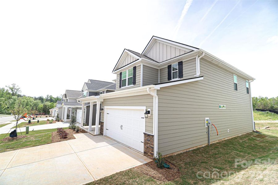 Front exterior of a new home in , Denver, NC, highlighting curb appeal (Image 13).