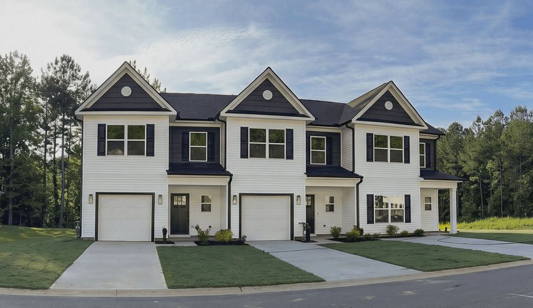 Representative exterior photo of a completed home built from the 1557 Townhome by Adams Homes in Parkstone Place Townhomes, Roebuck, SC (Image 1). Representative exterior photo of a completed home built from the 1557 Townhome by Adams Homes in Parkstone Place Townhomes, Roebuck, SC (Image 1).