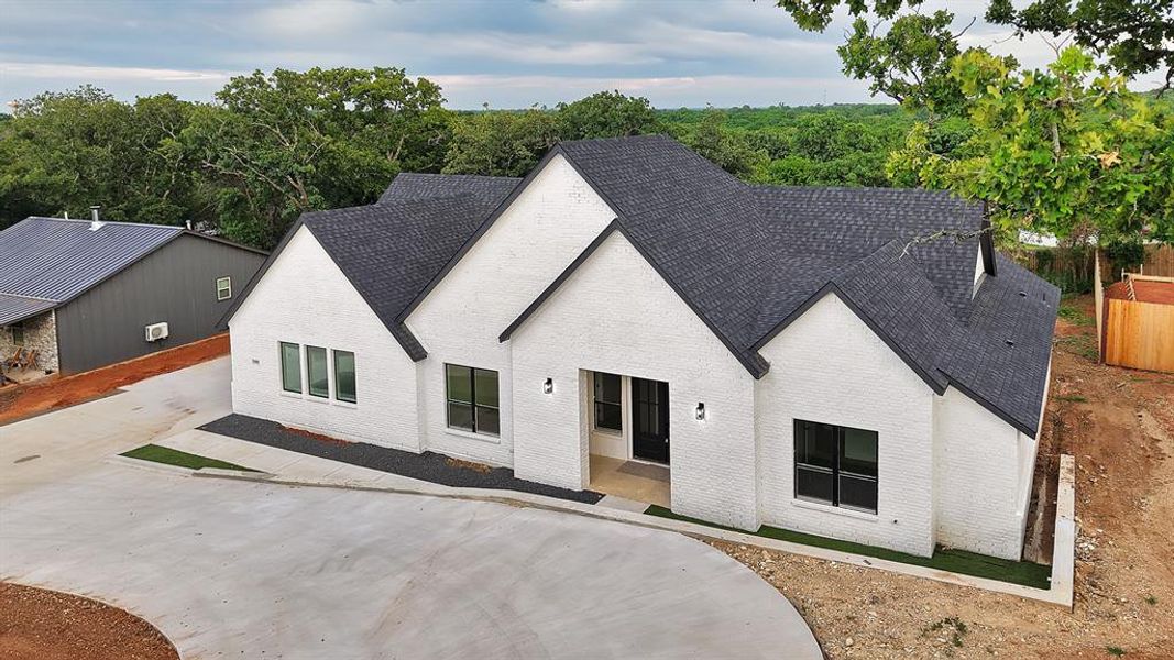 Front exterior of a new home in , Joshua, TX, highlighting curb appeal (Image 24).