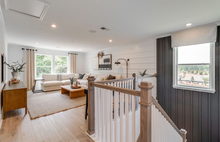 An expansive upstairs loft bathed in abundant natu