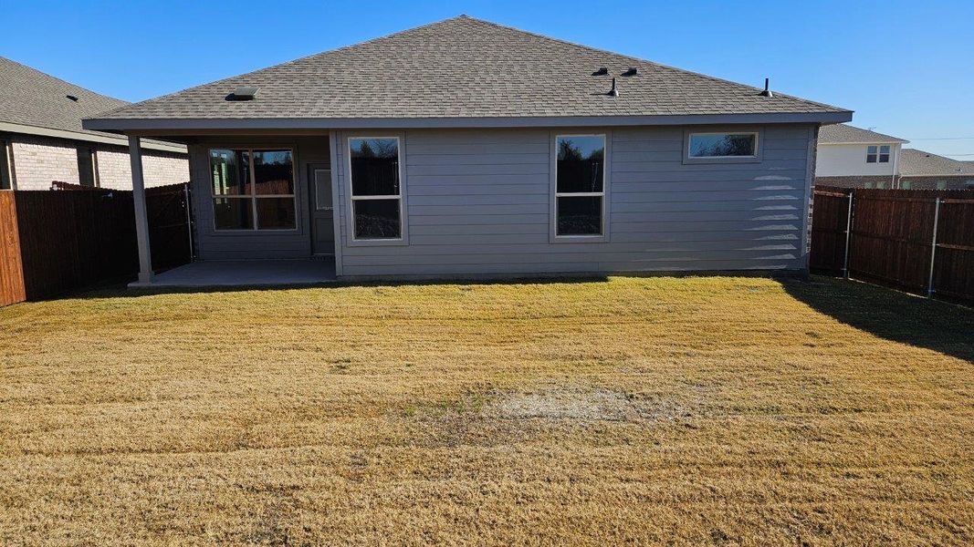 Exterior details and patio area of a home in Monarch at the Meadows, Ponder (Image 2). Exterior details and patio area of a home in Monarch at the Meadows, Ponder (Image 2).