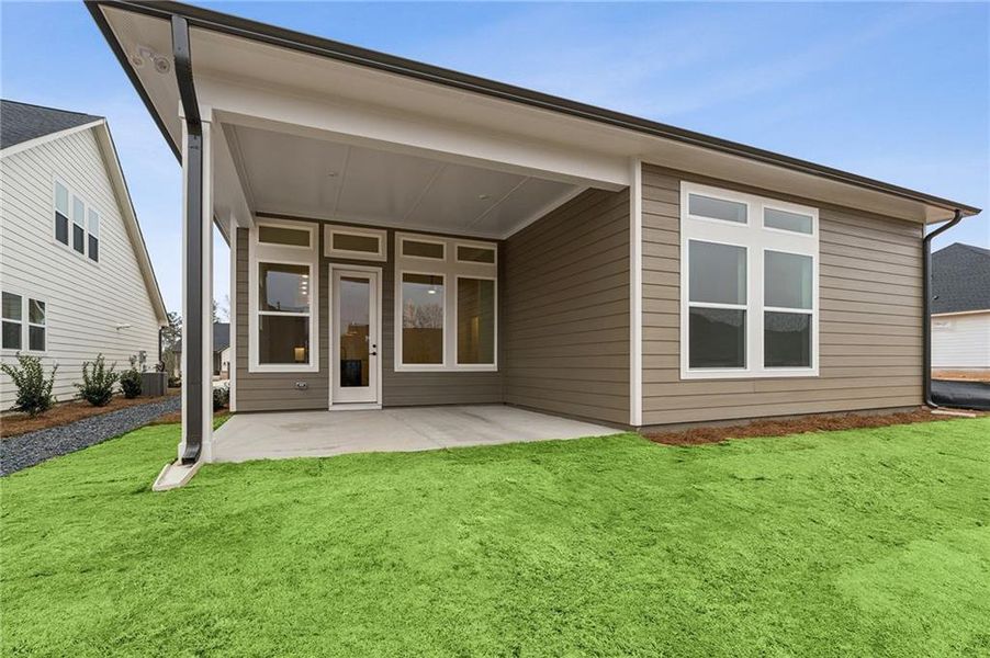 Exterior details and patio area of a home in Crescent Pointe at Great Sky, Canton (Image 3).