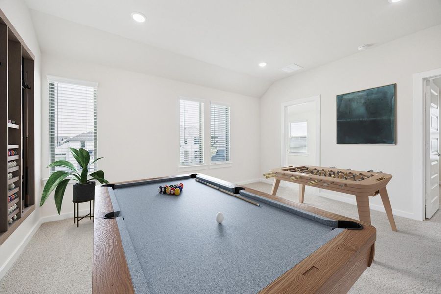 A well-lit game room features a classic billiards table and a foosball table, offering endless entertainment. A well-lit game room features a classic billiards table and a foosball table, offering endless entertainment.