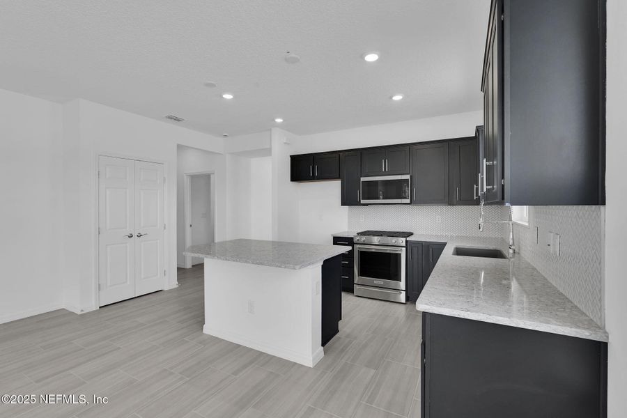 Furnished interior view inside a new home in Del Webb Wildlight, Yulee (Image 6).
