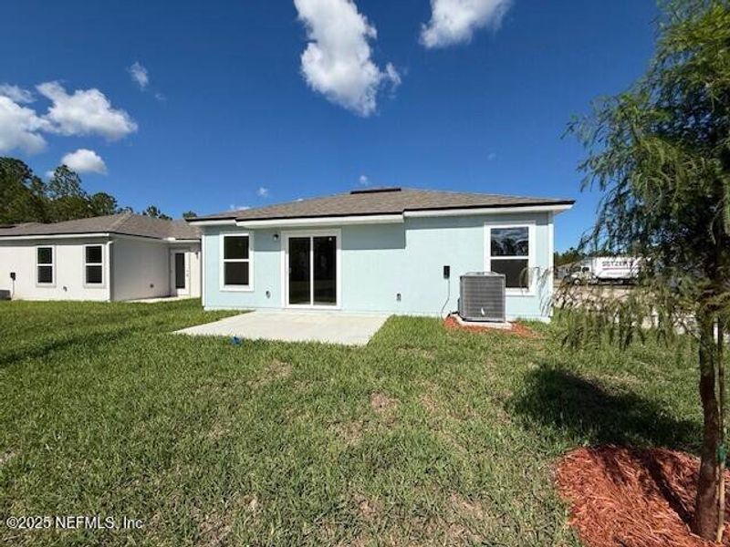 Exterior details and patio area of a home in Grand Reserve, Bunnell (Image 26).