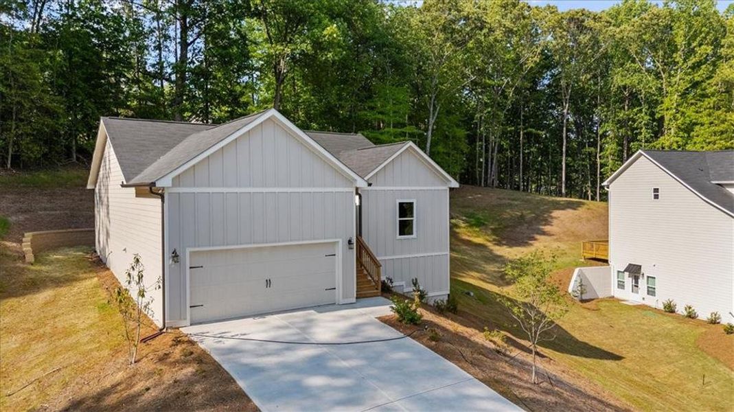 Front exterior of a new home in , Gainesville, GA, highlighting curb appeal (Image 22).