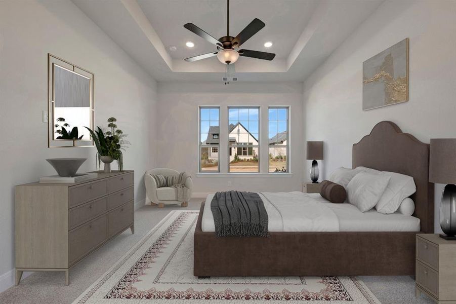 Bedroom featuring light colored carpet, ceiling fan, recessed lighting, and a tray ceiling