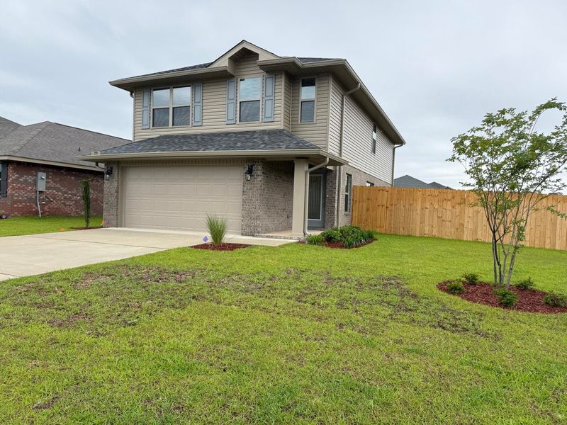 Front exterior of a new home in Ridgeway Landing, Crestview, FL, highlighting curb appeal (Image 1). Front exterior of a new home in Ridgeway Landing, Crestview, FL, highlighting curb appeal (Image 1).