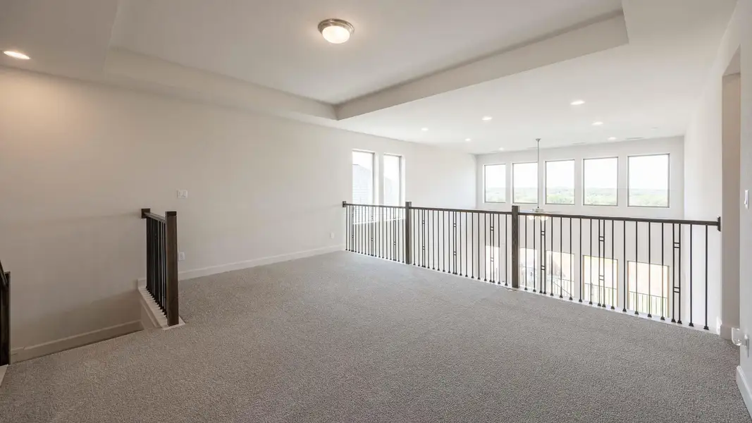 Hallway featuring recessed lighting and carpet flooring Hallway featuring recessed lighting and carpet flooring