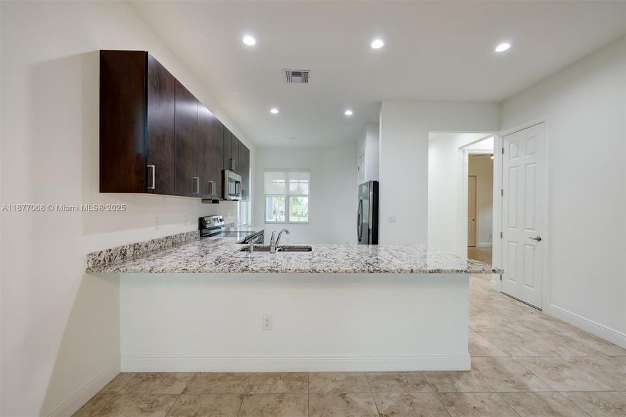 Furnished interior view inside a new home in , Port St. Lucie (Image 4).