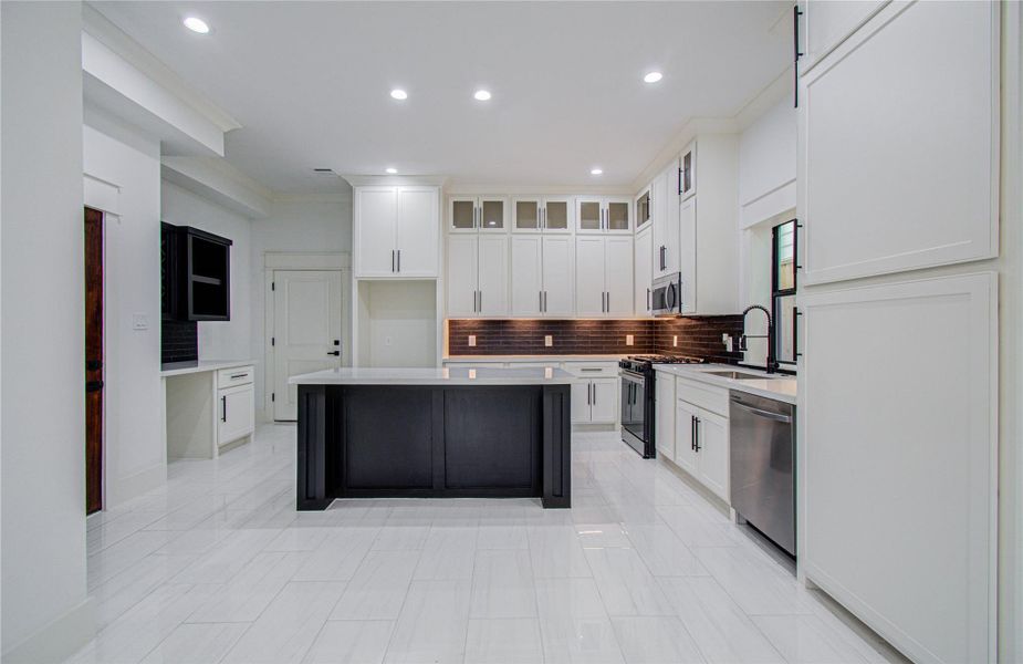 Ample lighting and high ceilings create an open, airy feel.