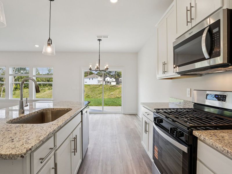 Prep dinner in the kitchen without missing the conversation in the great room.