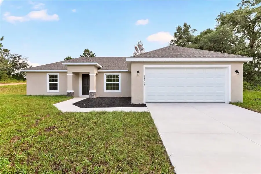 Front exterior of a new home in , Dunnellon, FL, highlighting curb appeal (Image 25).