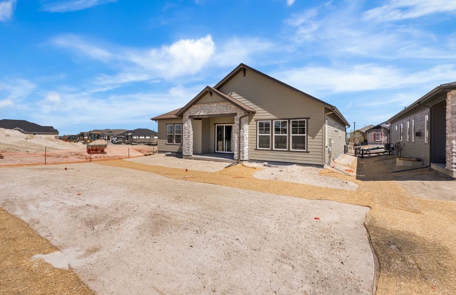 Exterior details and patio area of a home in Hilltop at Inspiration, Aurora (Image 27).