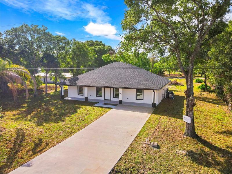 Front exterior of a new home in , Okeechobee, FL, highlighting curb appeal (Image 20).