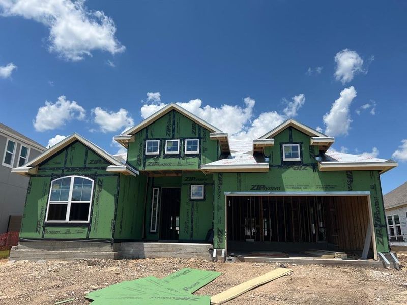 Unfinished property featuring a garage Unfinished property featuring a garage