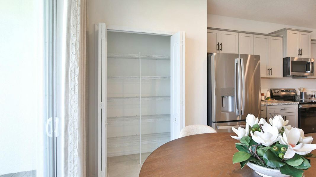 Furnished interior view inside a new home in Palm Grove Real Estate and Homes for Sale in Lakewood Ranch, FL - Neal Communities, Lakewood Ranch (Image 17).