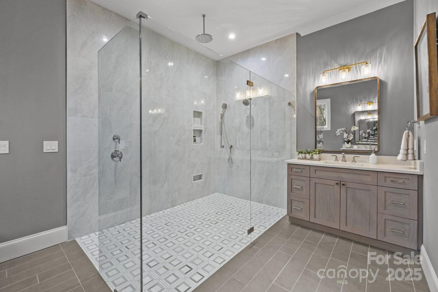 Primary suite bathroom with additional vanity