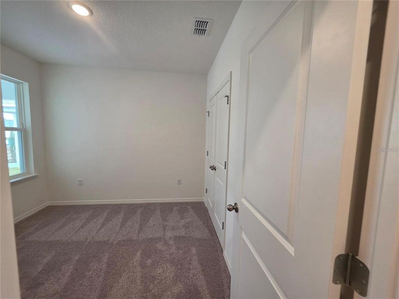 Spacious, unfurnished interior of a new home in Hammock Reserve, Haines City (Image 24). Spacious, unfurnished interior of a new home in Hammock Reserve, Haines City (Image 24).