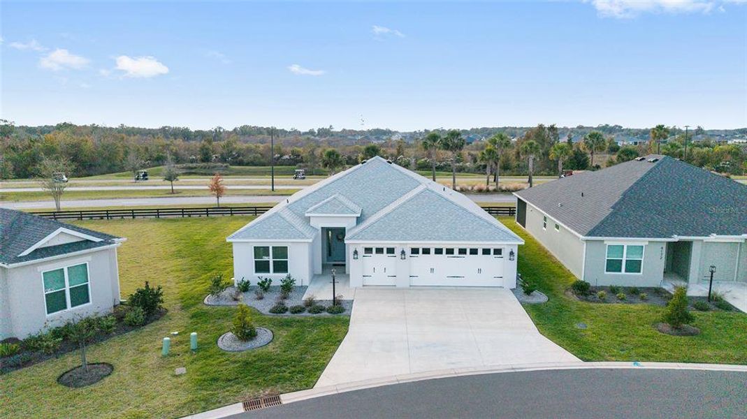 Front exterior of a new home in , The Villages, FL, highlighting curb appeal (Image 25).