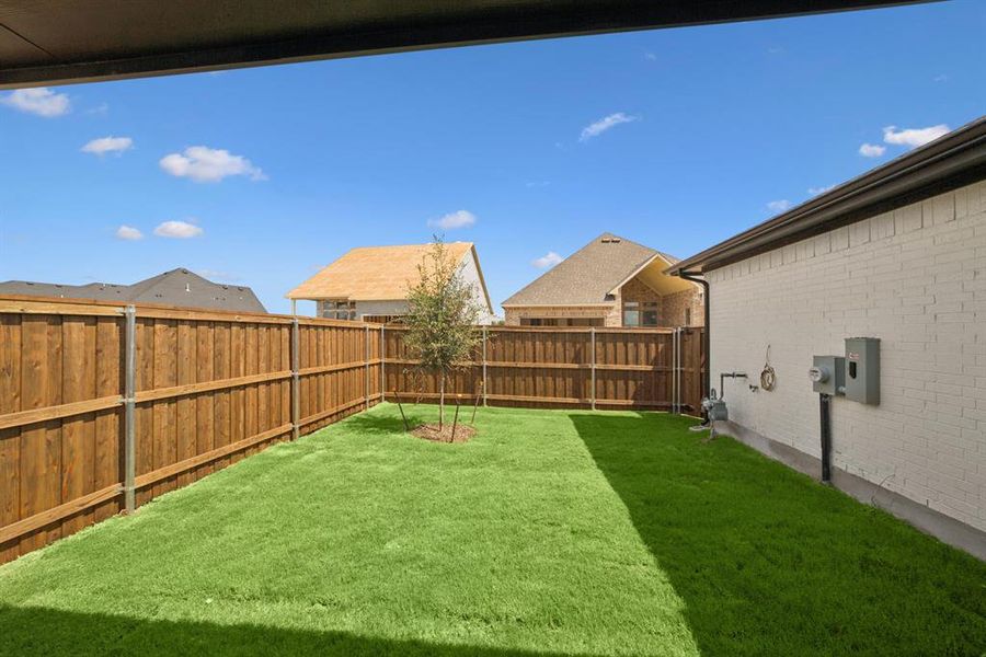 Exterior details and patio area of a home in Karis - Village Series, Crowley (Image 2). Exterior details and patio area of a home in Karis - Village Series, Crowley (Image 2).