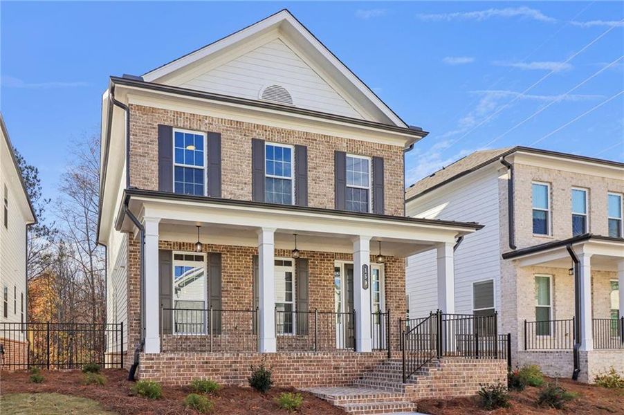 Front exterior of a new home in Brackley Single Family, Cumming, GA, highlighting curb appeal (Image 30). Front exterior of a new home in Brackley Single Family, Cumming, GA, highlighting curb appeal (Image 30).