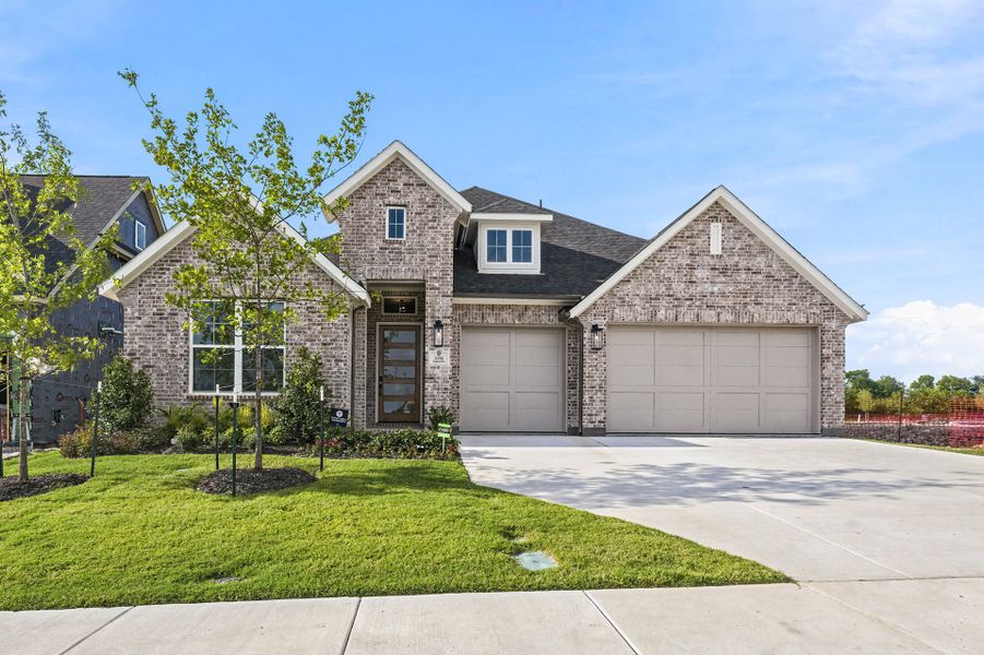 Front exterior of a new home in The Homestead - 62', Rockwall, TX, highlighting curb appeal (Image 2). Front exterior of a new home in The Homestead - 62', Rockwall, TX, highlighting curb appeal (Image 2).