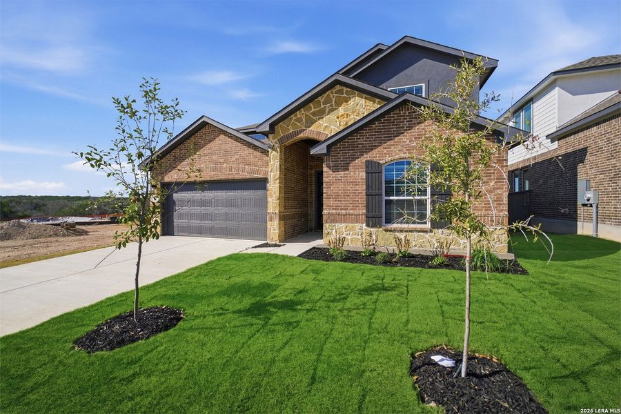 Front exterior of a new home in The Woodlands at Medina Hills, Mico, TX, highlighting curb appeal (Image 2).