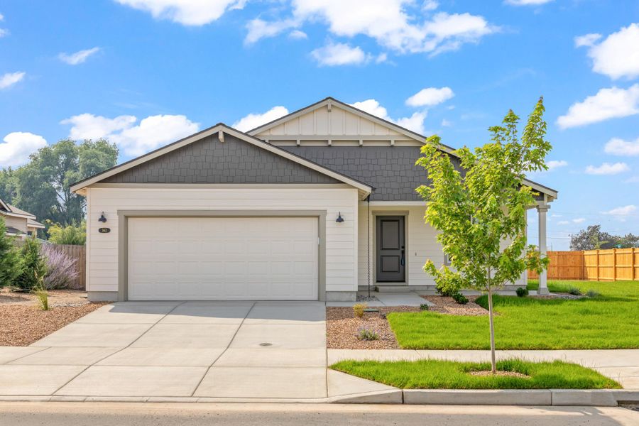 Front exterior of a new home in Willowbrook, Madras, OR, highlighting curb appeal (Image 2). Front exterior of a new home in Willowbrook, Madras, OR, highlighting curb appeal (Image 2).
