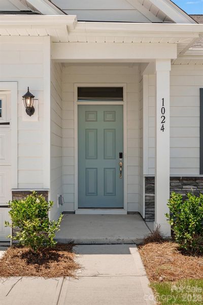 Exterior details and patio area of a home in Cottages at Indian Trail West, Indian Trail (Image 4).