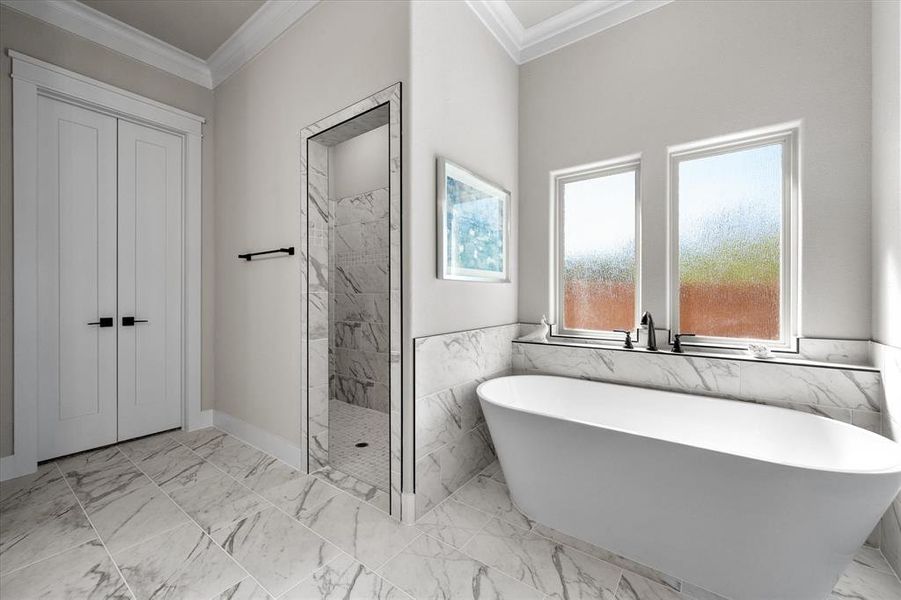 Bathroom featuring independent shower and bath, tile walls, and crown molding!